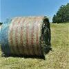 Freedom Wrap Hay Bales in a field in Monroe County. This particular hay bale was wrapped by Greg Maubach Farms.