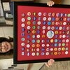 Monroe County Western Commissioner Marilyn O'Bannon holds a frame of 100-plus pins of elected county officials from the last century.